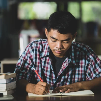 educational-theme-close-up-student-writing-classroom